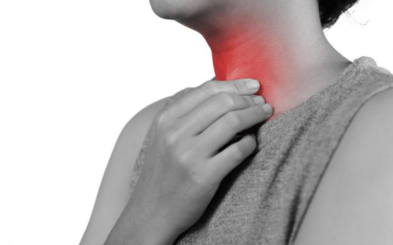 Woman with sore throat